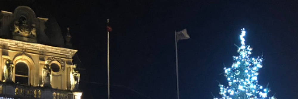 Ipswich Town Hall and Christmas tree lit up at night.
