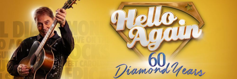 Neil Diamond tribute holding guitar out in front of him