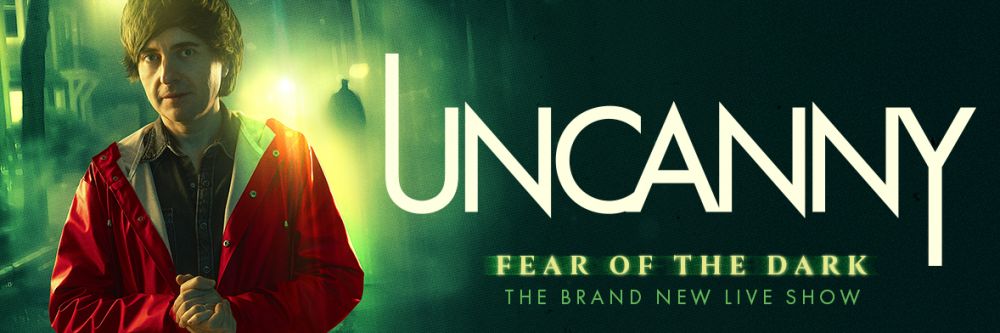 Danny lwearing red hoodie looking fearfully into camera