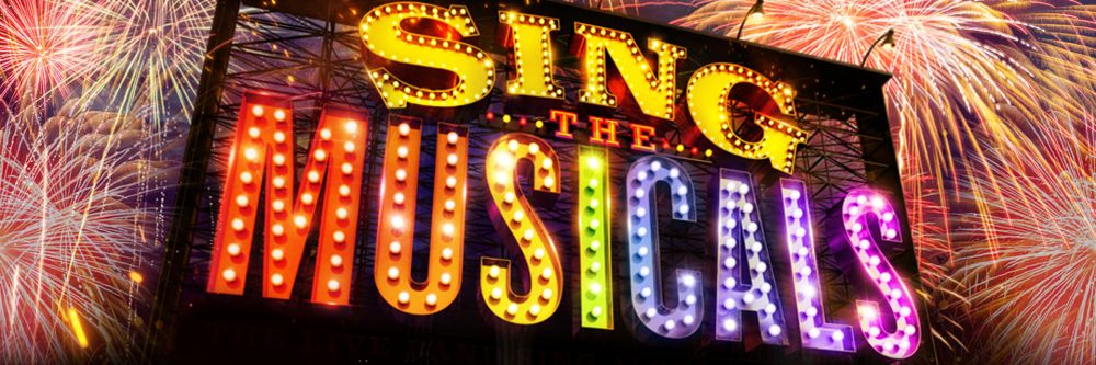 A billboard with writing in lights that reads'sing the musicals' in the background there is a dark night sky with fireworks